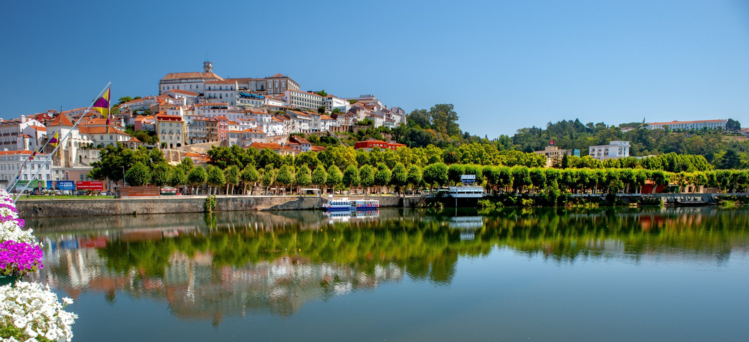 Coimbra Portugal skyline with Mondego River and historic university city visited on scenic Portugal tour