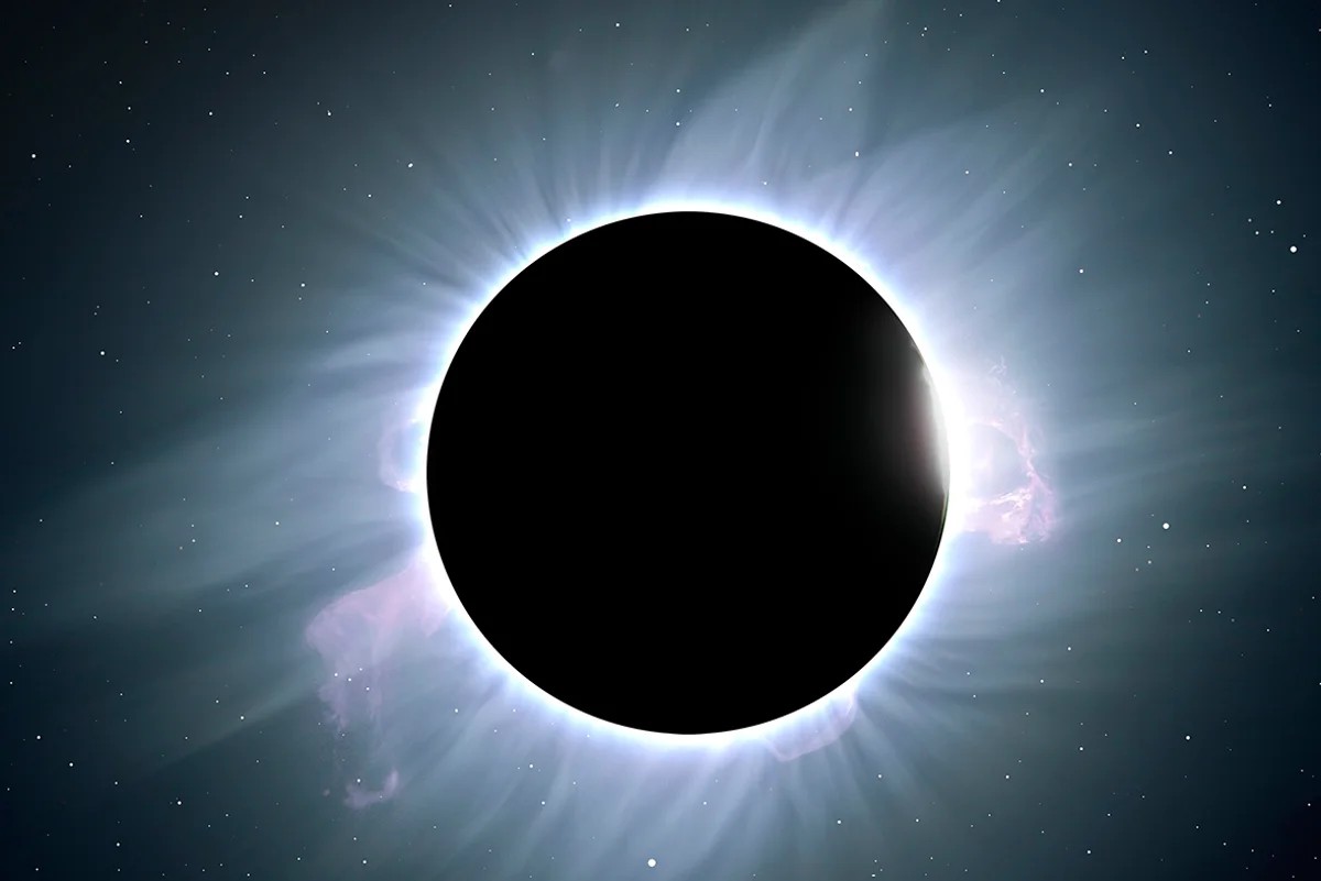 Solar eclipse viewed from space with bright corona surrounding the Moon